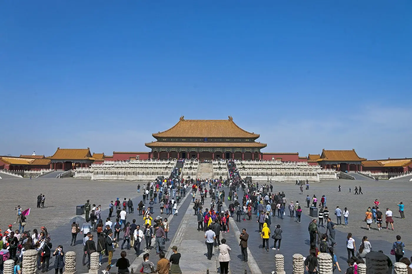 Visitors and tour guides in the courtyard of the Hall of Supreme Harmony in the Forbidden City, Beijing
