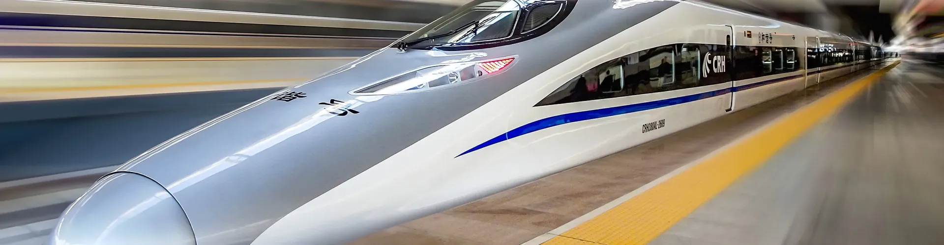 A Fuxing high-speed train pulling into a station in China